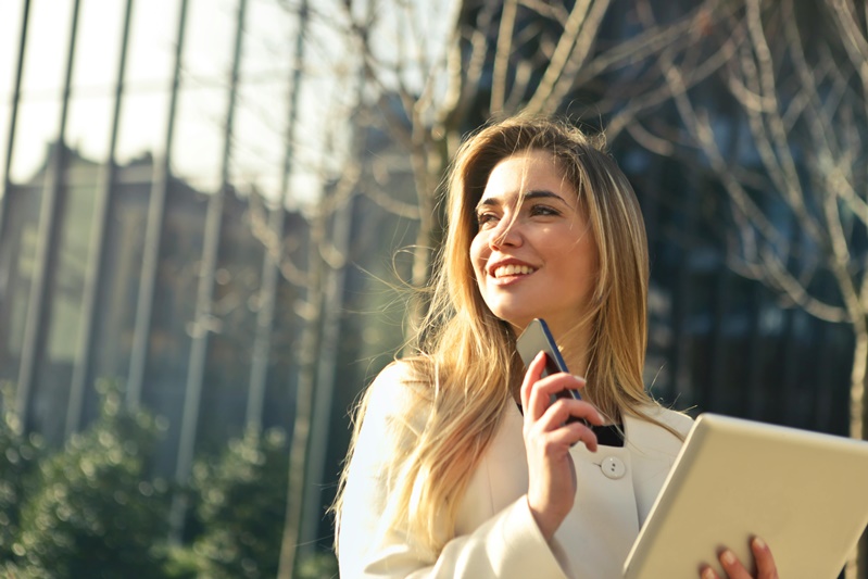 female realtor holding phone