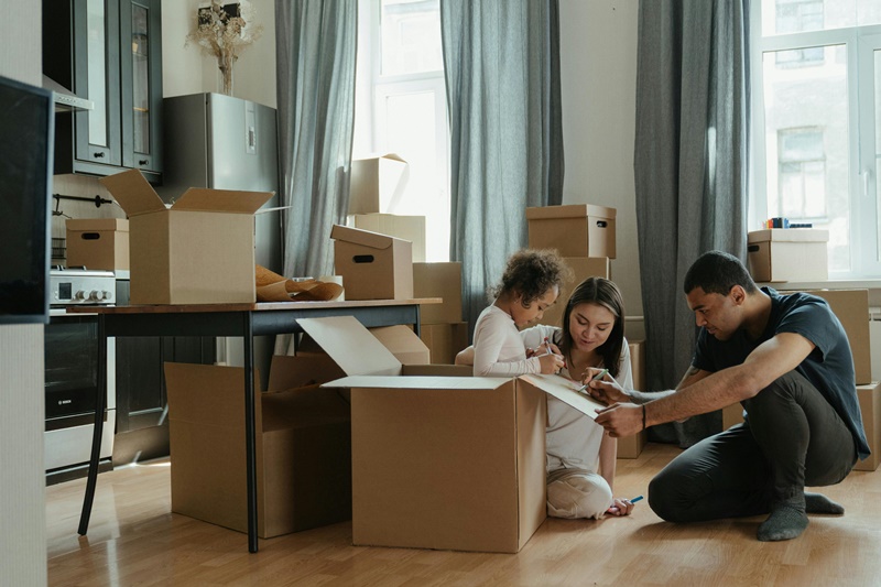 family packing up boxes